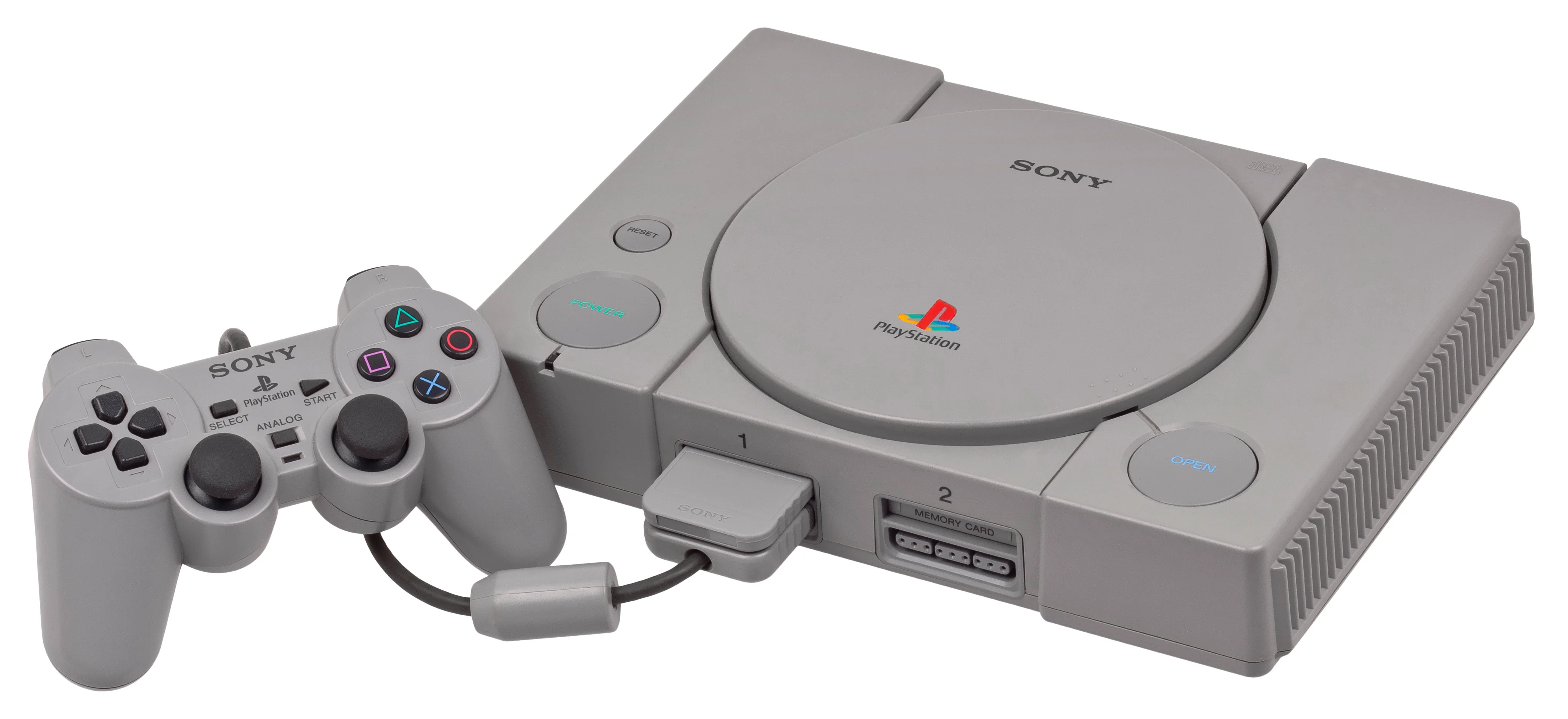 PlayStation konsolu ve orijinal DualShock kontrolcüsü bir arada